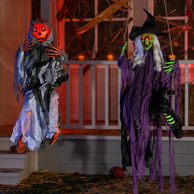 Pair of white swinging ghost Halloween decorations
